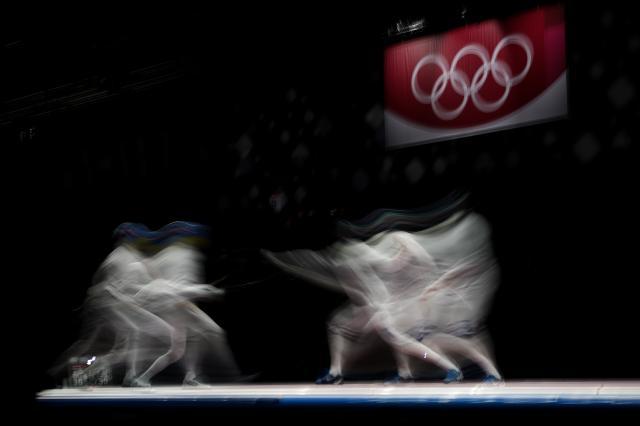 万博体育-日媒：菅义伟不考虑取消奥运 男重团体金牌“悲愿”